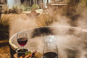 Wood fired hot tub by night in the Macedon Ranges at Lancefield's Cleveland Estate